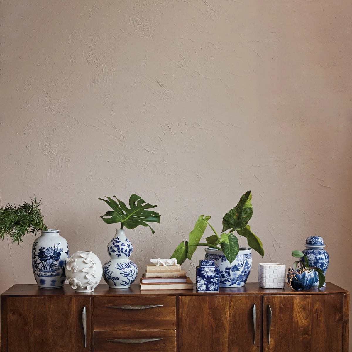 Round handmade stoneware vase with reactive glaze featuring a bird pattern.
