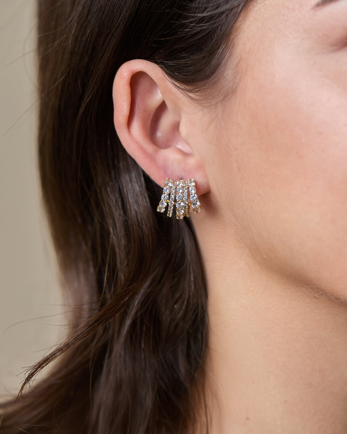 Maeve Quintuple Hoop Earrings in gold-tone metal featuring five concentric circular hoops with a polished finish.