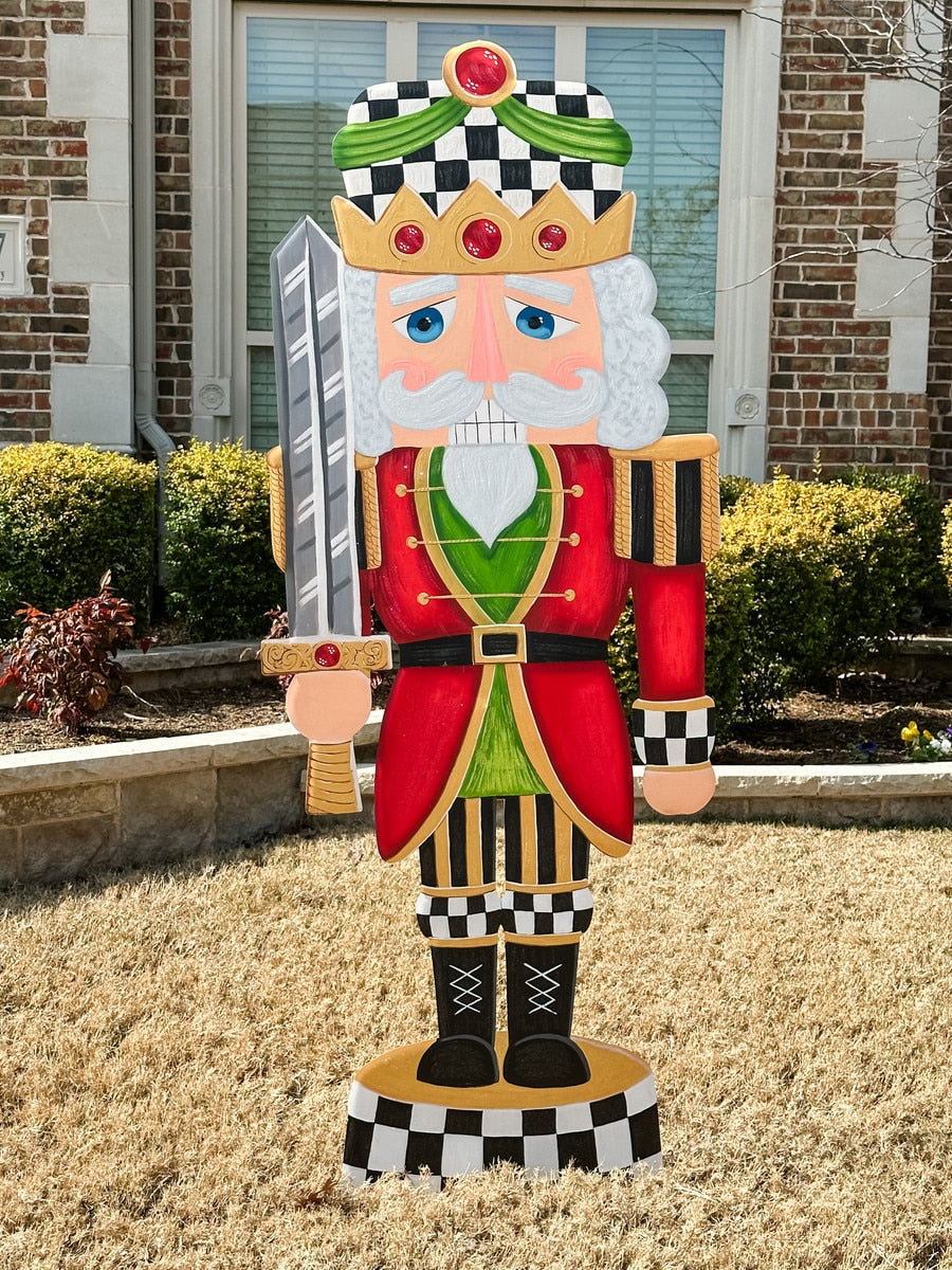 Stake easel nutcracker with elegant dark wood finish and classic soldier silhouette.