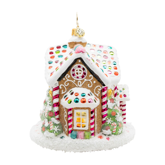 Sweet Treat House gingerbread ornament with white icing, colorful candy dots, and glitter accents.