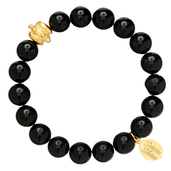 Stretch bracelet with hand-strung genuine stone beads in varied hues featuring a gold Bentley bead accent.
