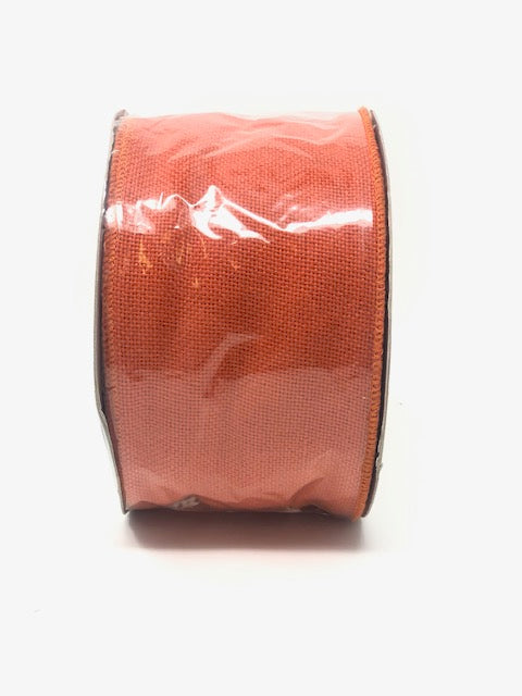 Orange ribbon measuring four inches by twenty-five yards.