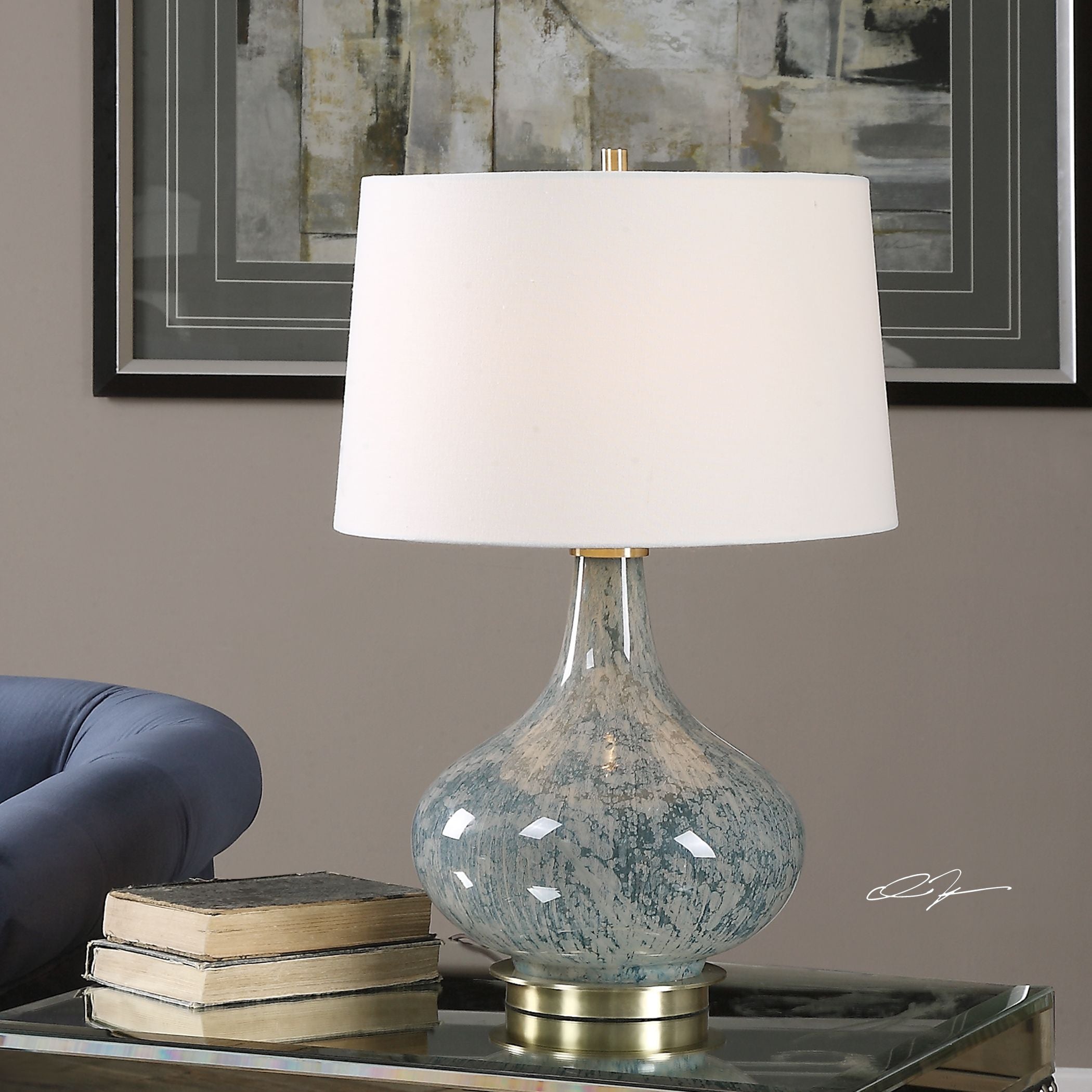 Celinda blue gray glass table lamp with a curved silhouette