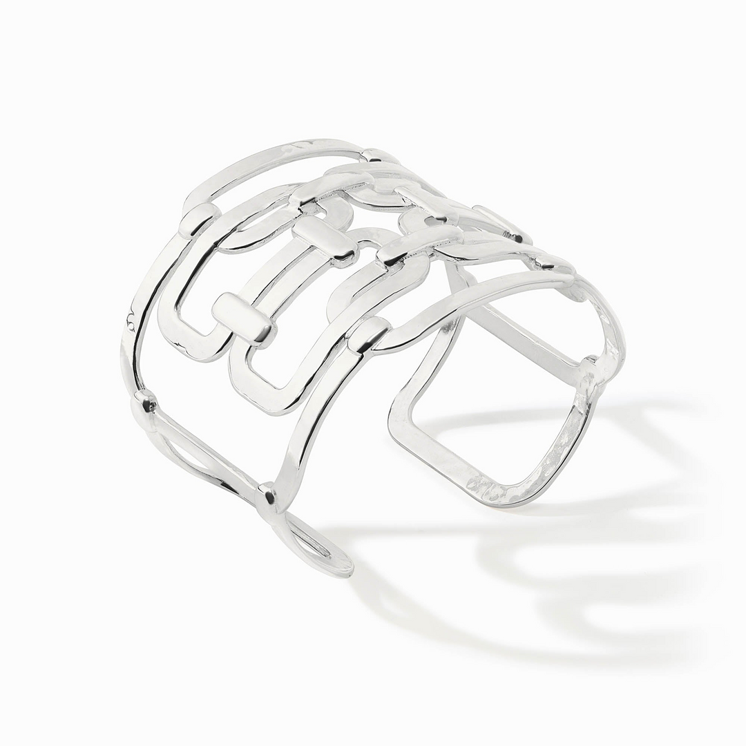 Sahara Statement Cuff in polished silver featuring an intricate, openwork geometric link design.