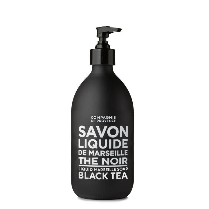 Matte black glass bottle of Compagnie de Provence Black Tea Liquid Marseille Soap with pump.