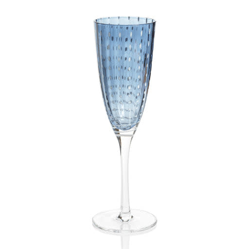 Navy blue Portofino champagne flute with white dot pattern on a clear glass stemware silhouette.