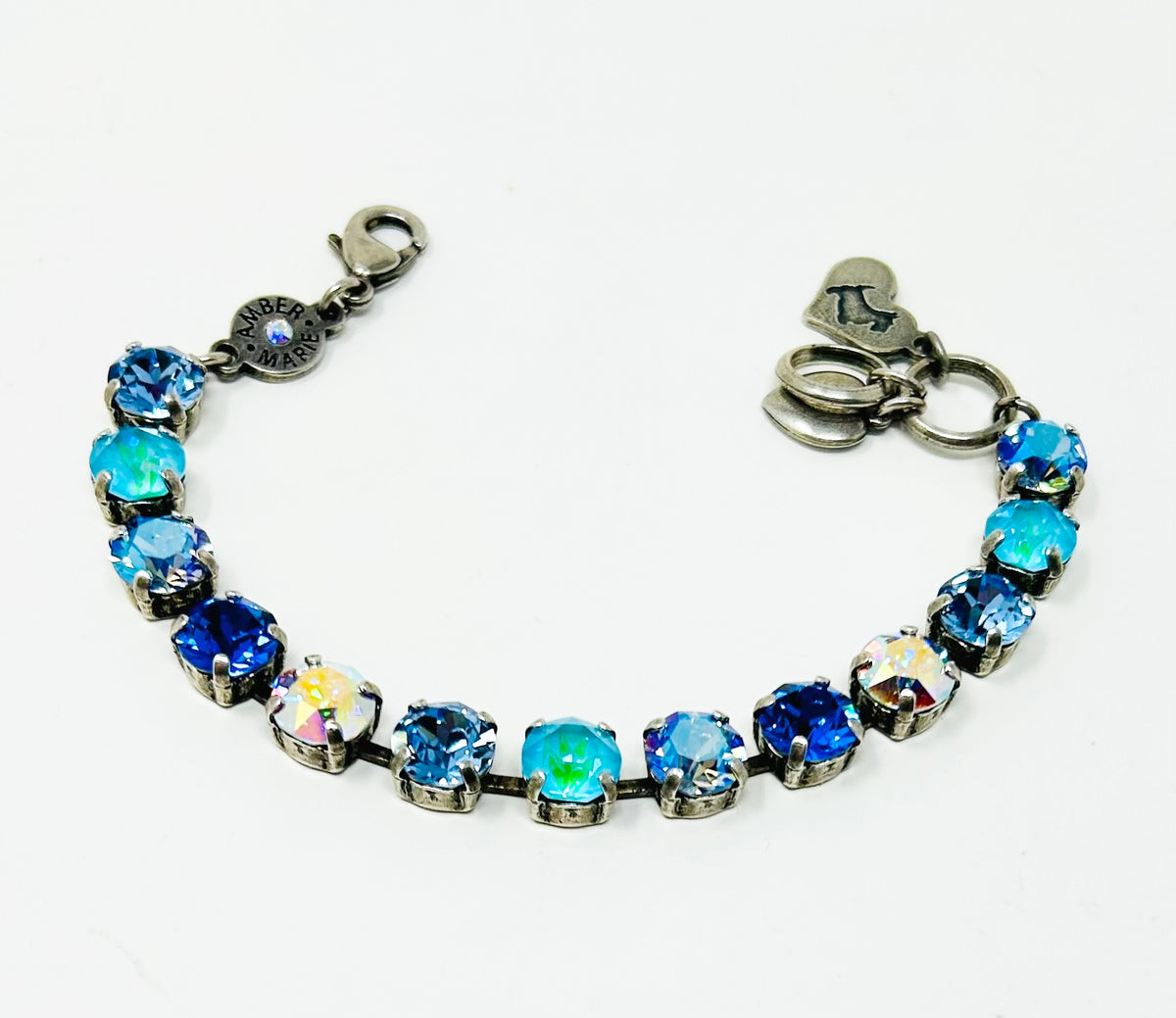 Classic Santorini bracelet featuring blue ombre stones, amber tag with crystal, and Scotty dog heart charm.