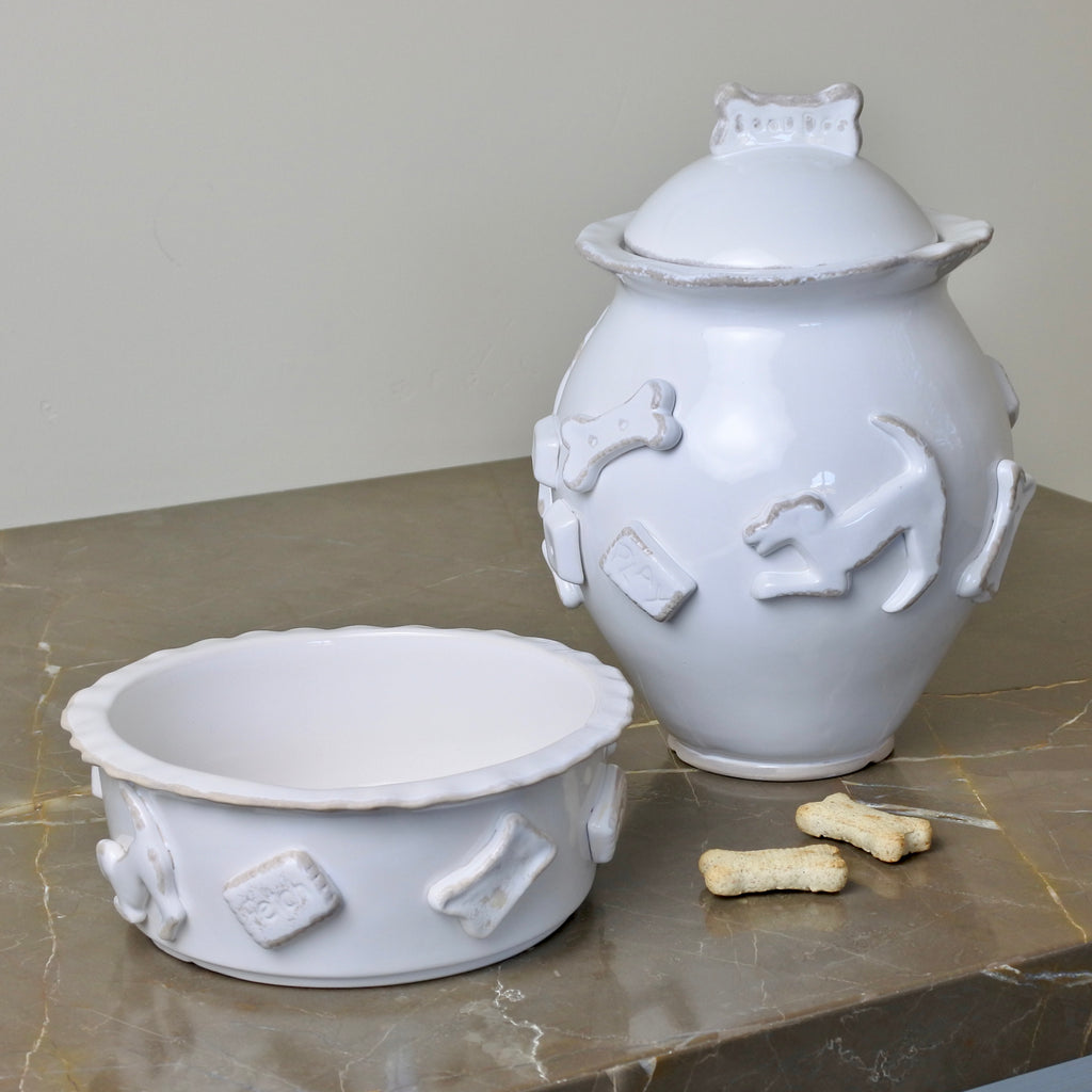 Hand-decorated ceramic dog treat jar with raised appliques and a Good Dog cookie topper.