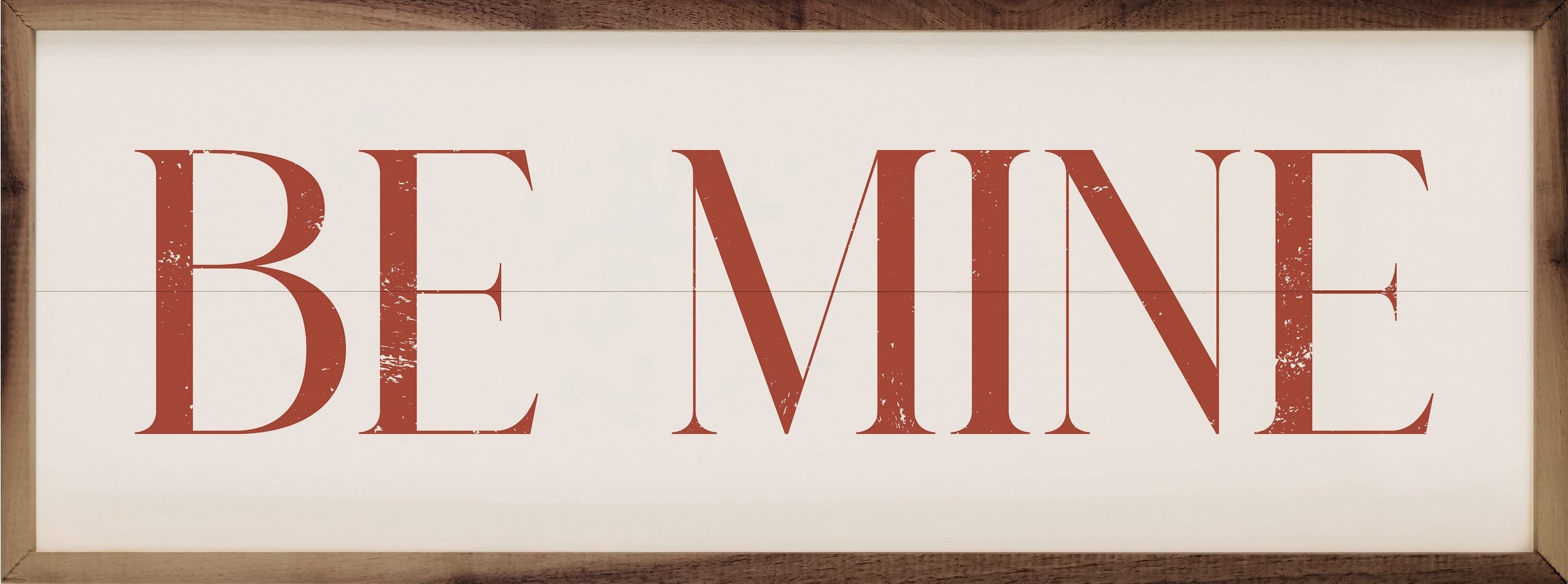 Red "BE MINE" text on a white wood plank background with a natural walnut frame.