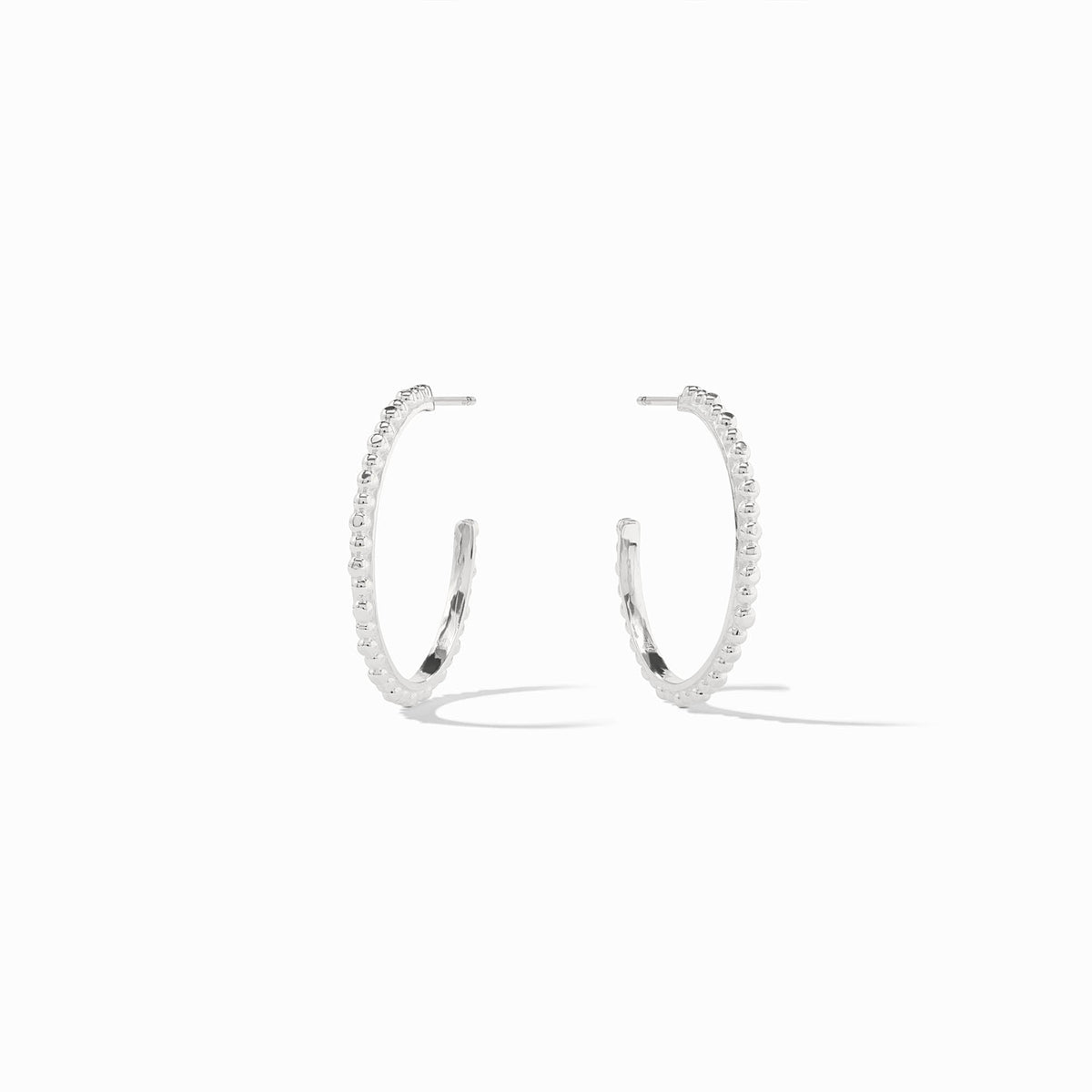 A pair of silver Colette bead hoop earrings with a textured, beaded design on a white background.