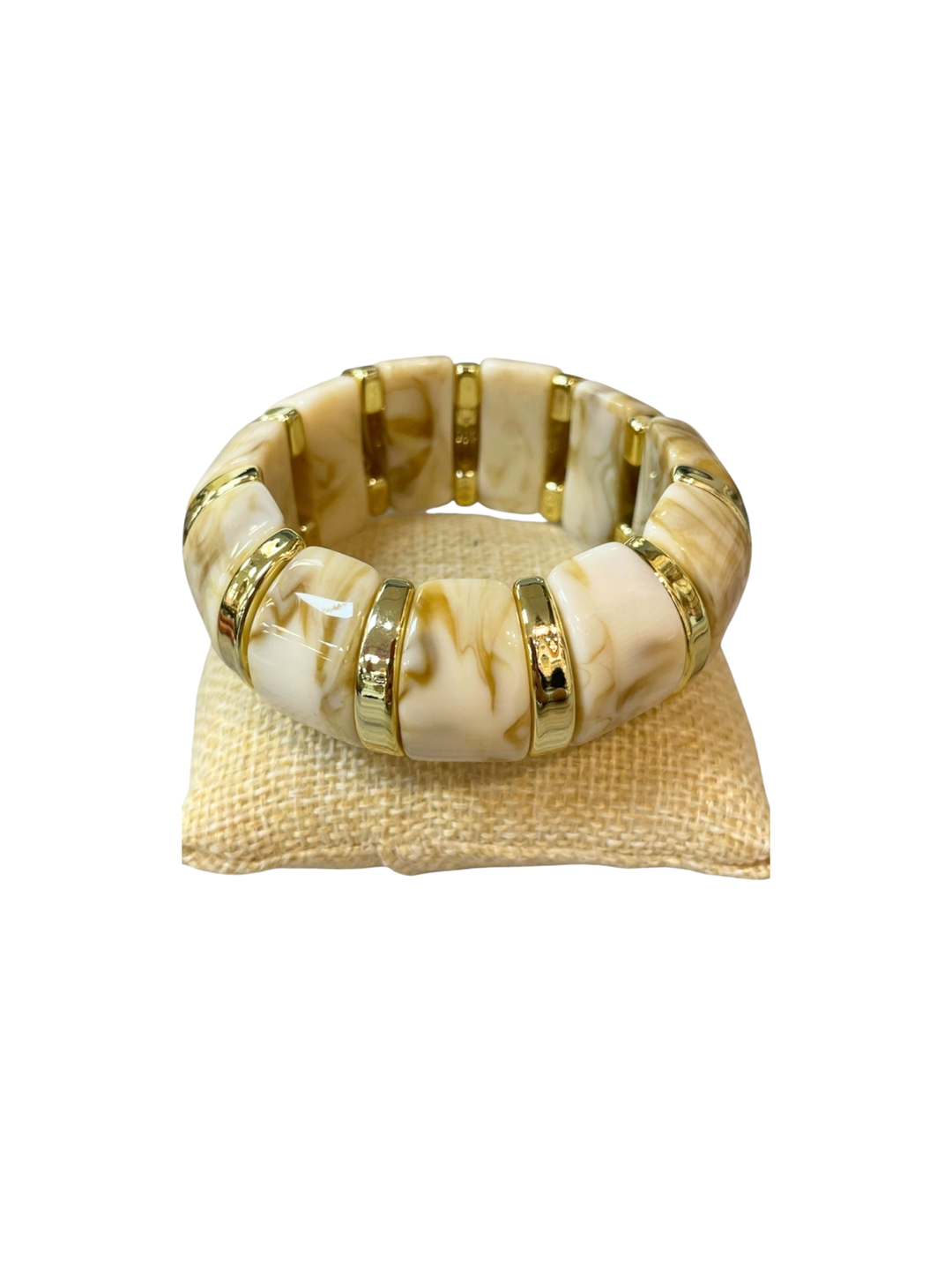Marbled stretch bracelet with chunky cream and tan rectangular beads and gold-tone spacer rings.