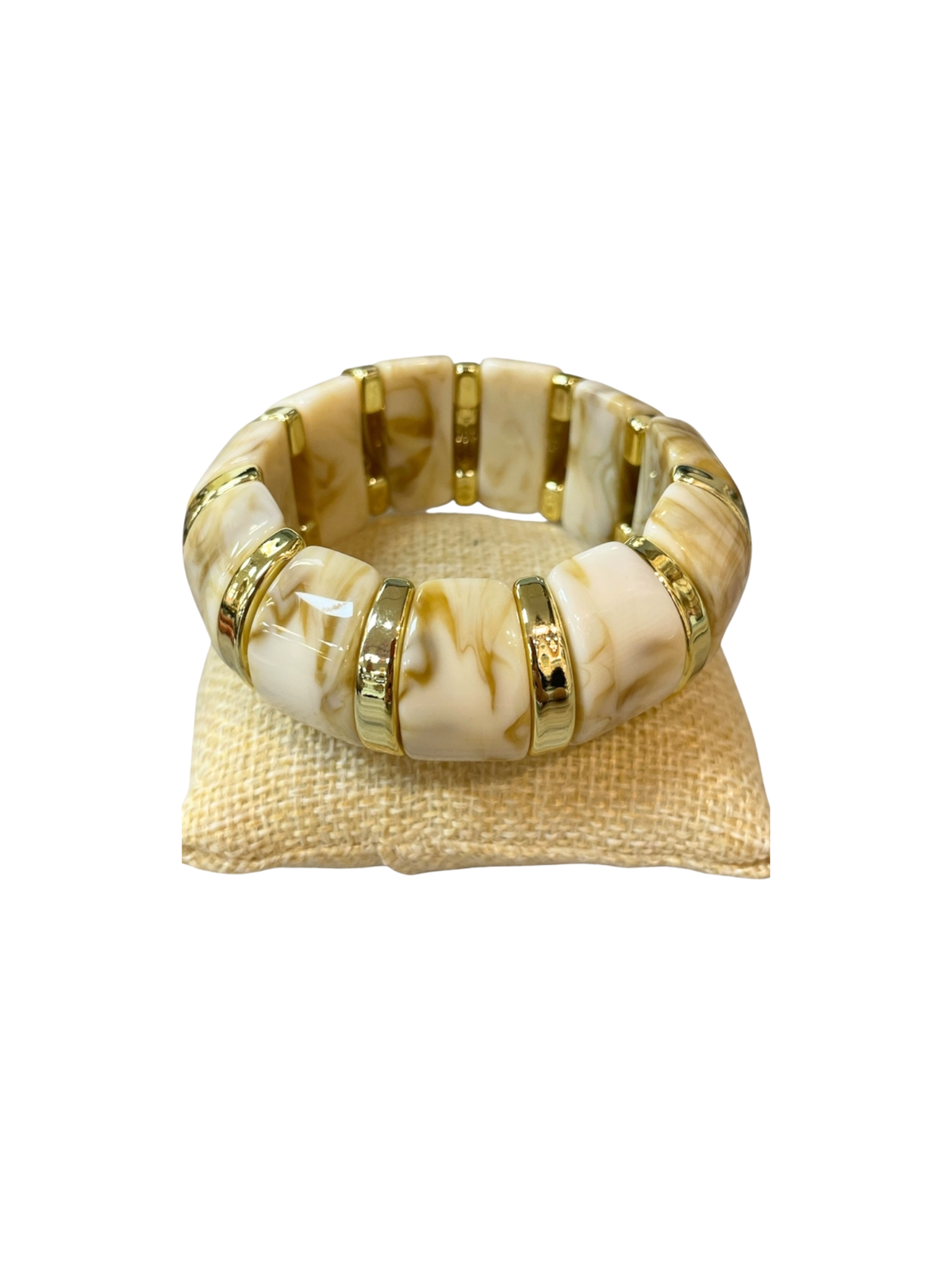 Marbled stretch bracelet with chunky cream and tan rectangular beads and gold-tone spacer rings.