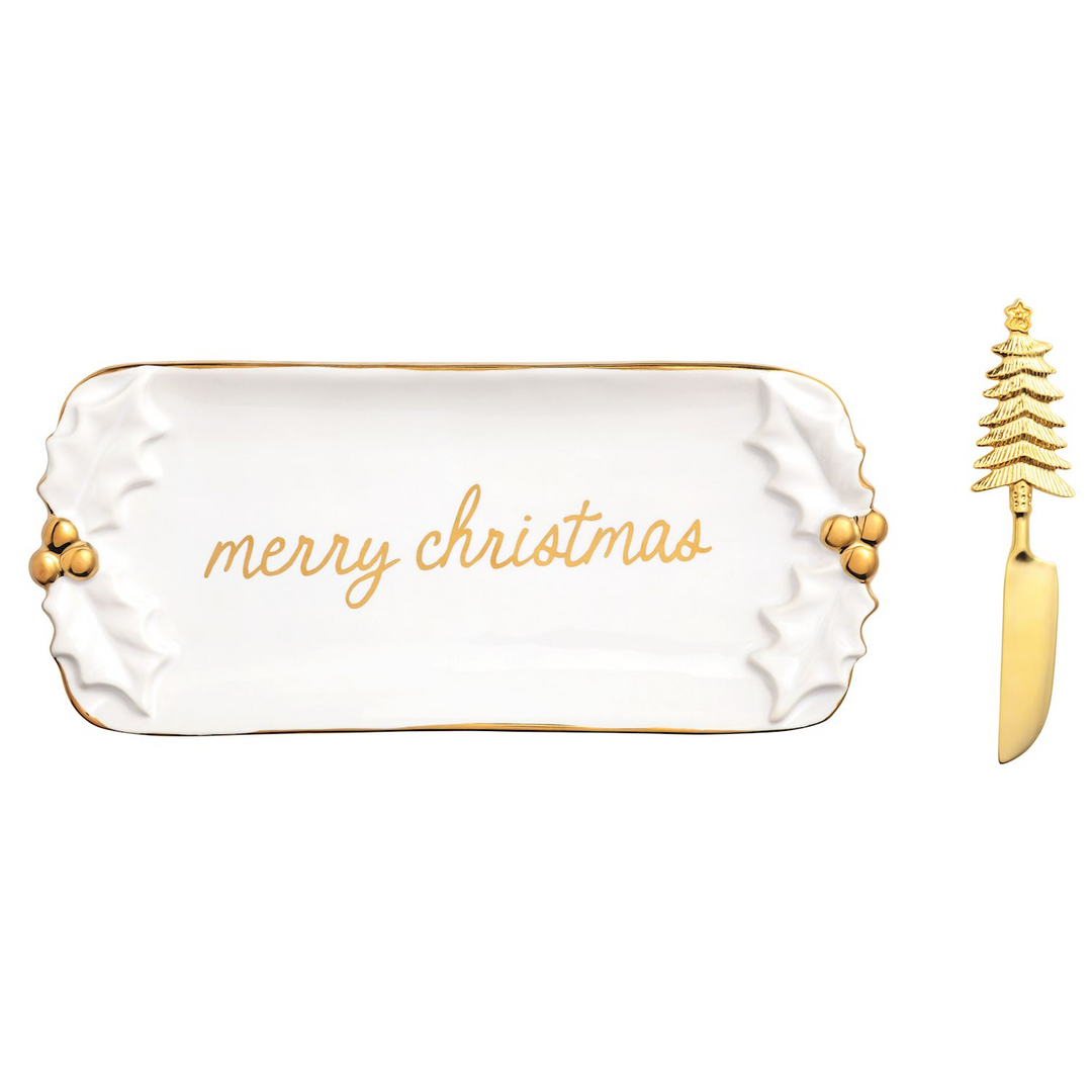 White stoneware butter dish with gold 'merry christmas' text and a gold tree-handle spreader.