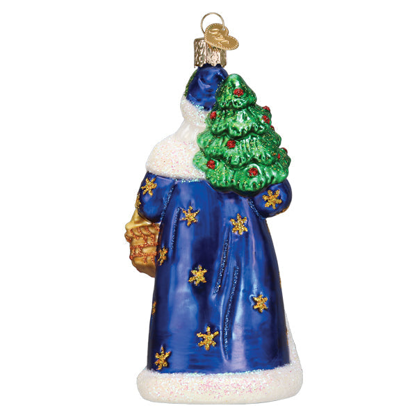 Regal Father Christmas glass ornament in a blue robe with gold stars, carrying a green tree.