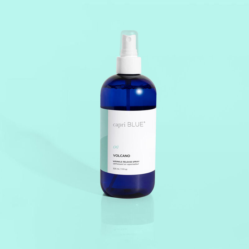 Capri Blue Volcano Wrinkle Release Spray in an 11 fl oz blue bottle with a white spray nozzle.
