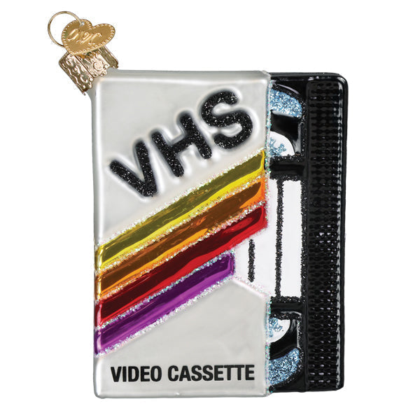 Glass VHS tape Christmas ornament with retro rainbow stripes and glitter accents.