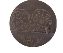 Close-up of a brown leather journal featuring an embossed floral heart design.
