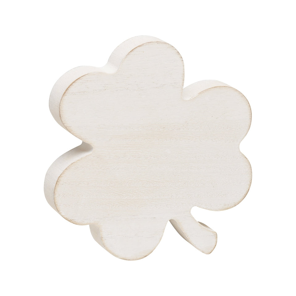 Large white washed wood clover cutout measuring four inches wide.