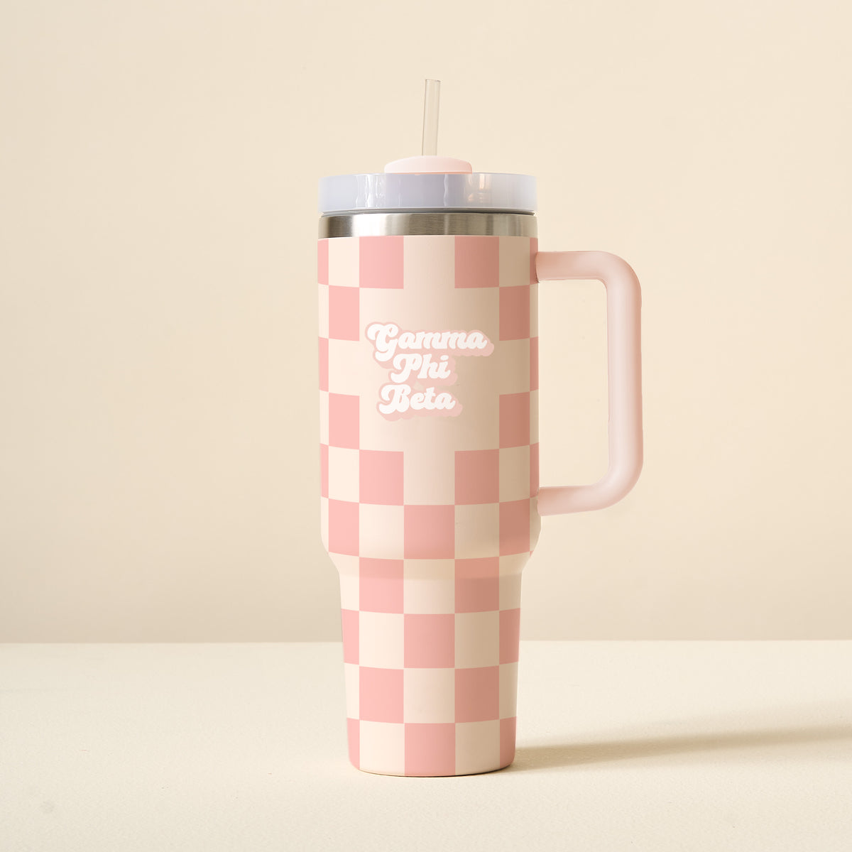 Pink and cream checkered 40 oz tumbler with handle, straw, and Gamma Phi Beta text.