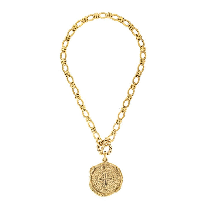 Gold-tone chain necklace with a textured crucifix medallion pendant and toggle clasp.
