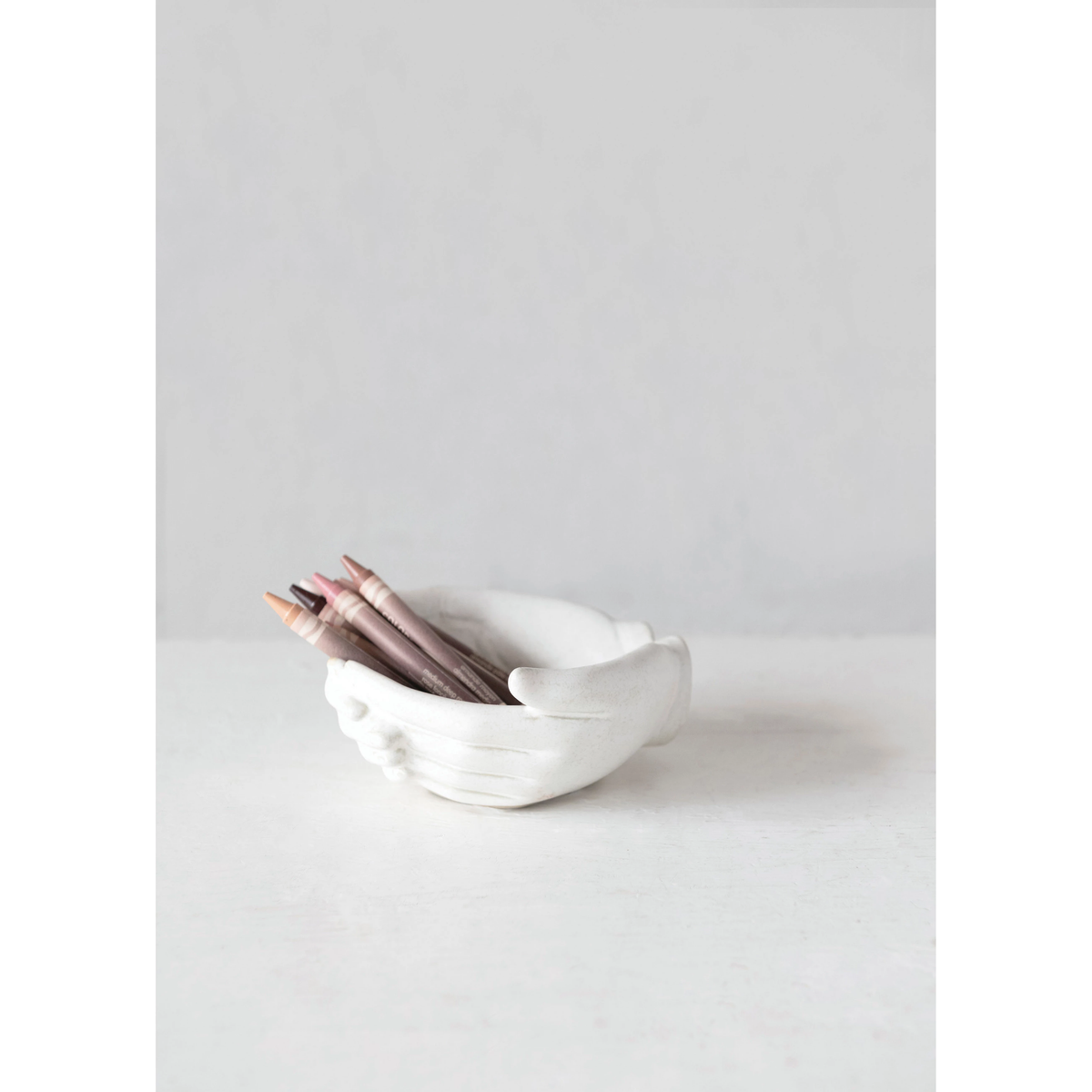 White stoneware hands bowl with reactive glaze finish