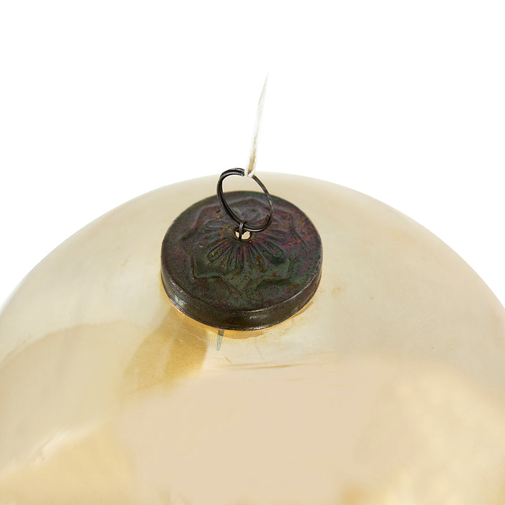 Gold glass ornament with a reflective metallic finish