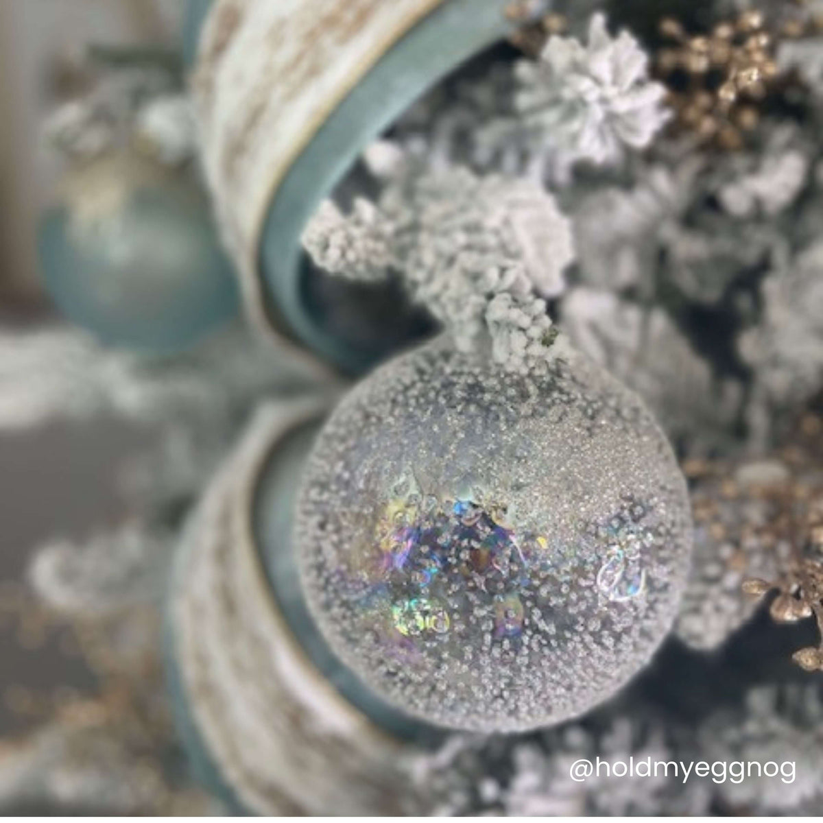 Clear glass spherical ornament with a textured surface measuring five inches in diameter.