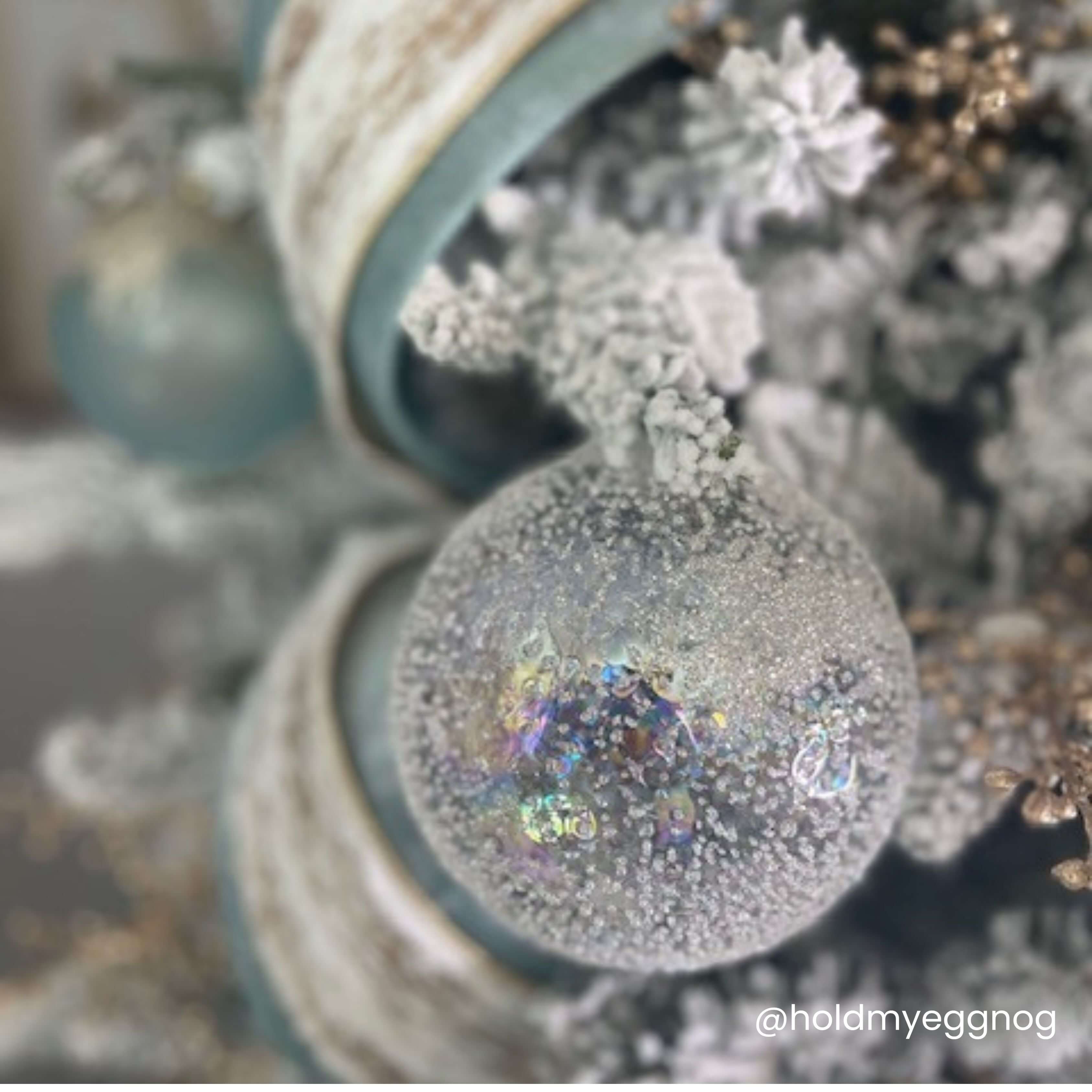 Clear glass spherical ornament with a textured surface measuring five inches in diameter.