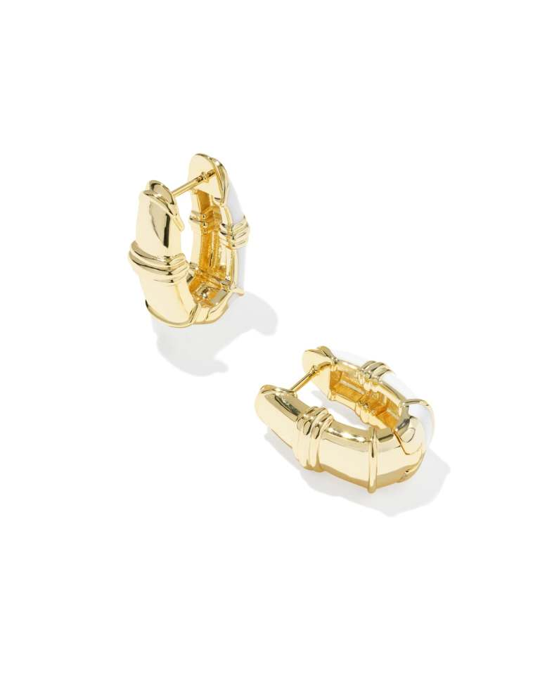 Courtney gold huggie earrings with white enamel and textured bamboo-style metalwork.