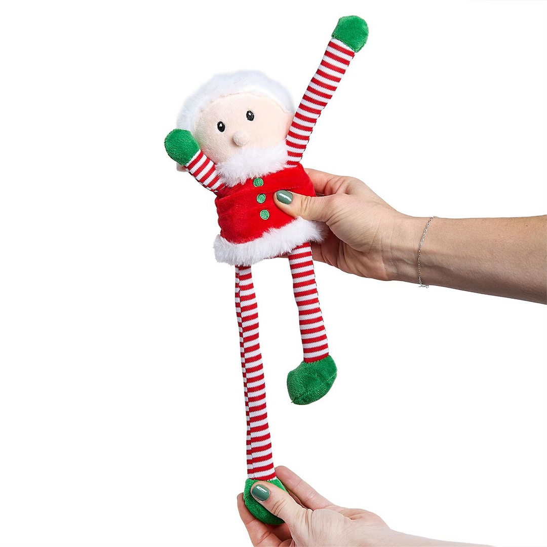 Elf plush toy with reversible red and white striped arms and legs, held by two hands.