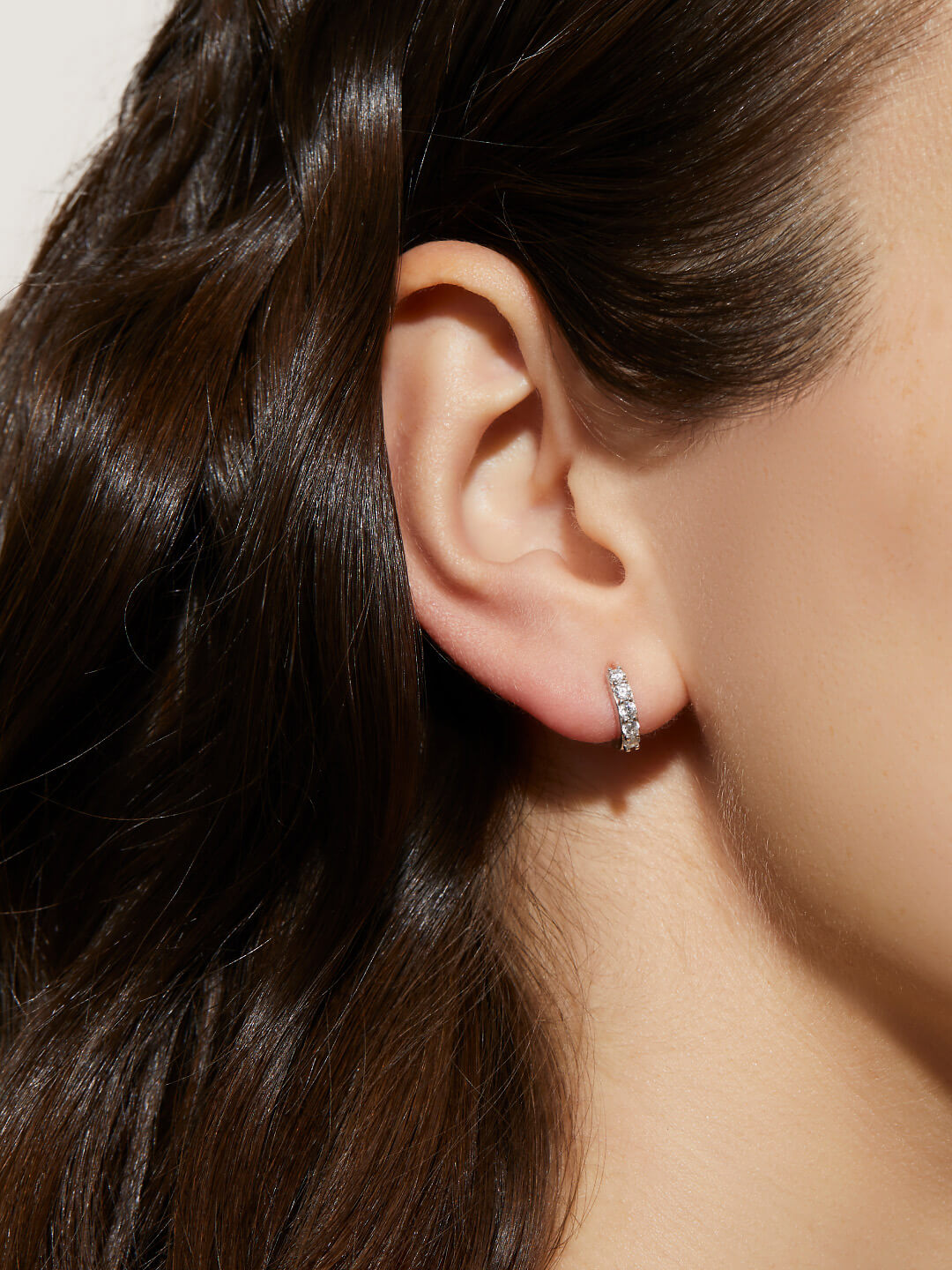 Sterling silver huggie hoop earrings with cubic zirconia accents