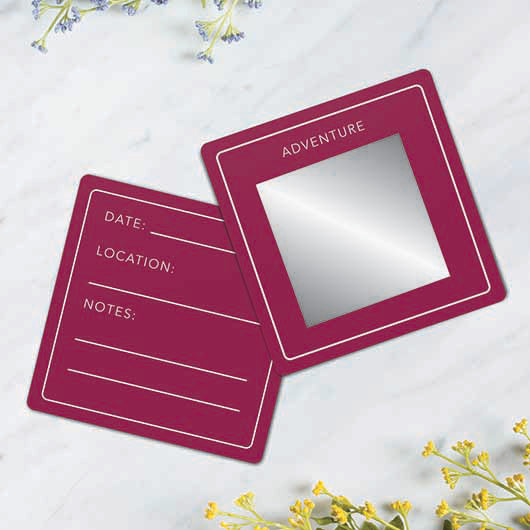 Two maroon scratch cards for 50th birthday activities, one with a silver panel and one for notes.