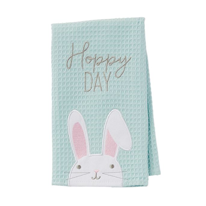 Light blue waffle weave towel with embroidered "Hoppy Day" text and a white bunny face with pink ears.