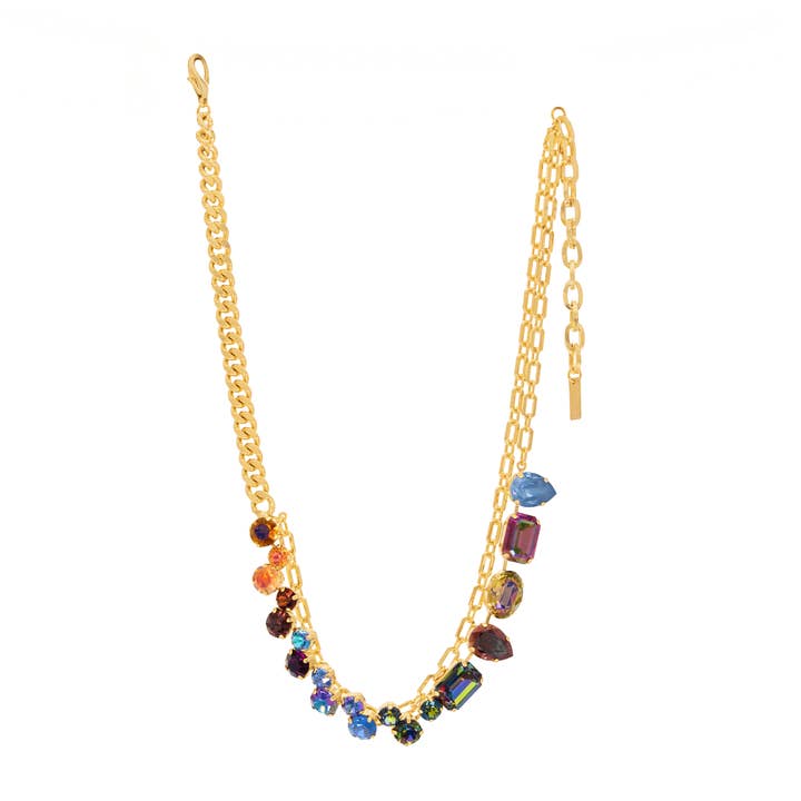 Thea Necklace featuring a gold-tone chain with a vibrant array of multi-colored crystal charms.
