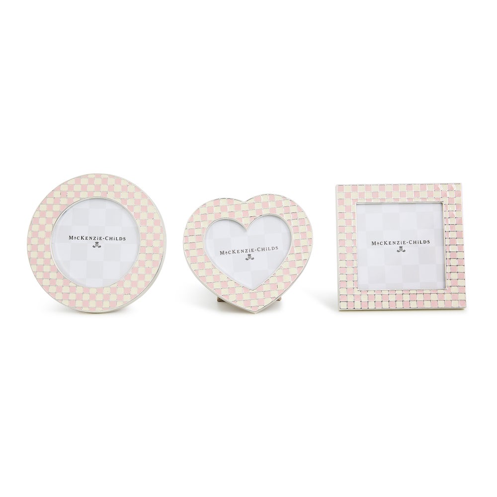 Set of three silver-plated MacKenzie-Childs frames in round, heart, and square with pink enamel checks