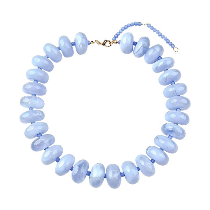 Bailey Chunky Beaded Necklace featuring large, glossy marbled blue beads with a gold-tone clasp.