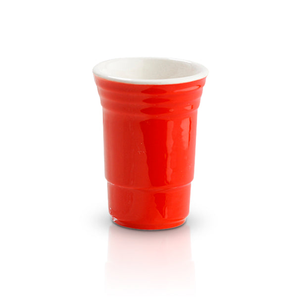 Red ceramic shot glass designed to look like a classic solo party cup with a white interior.