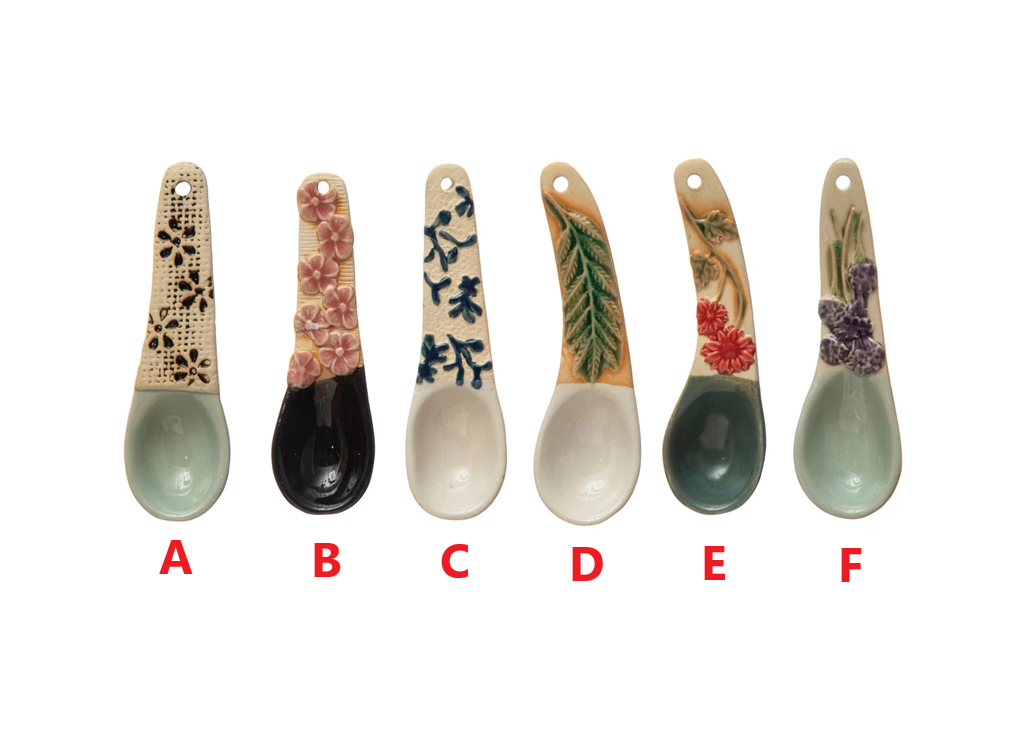 Stoneware spoon with floral-patterned handle in earthy tones