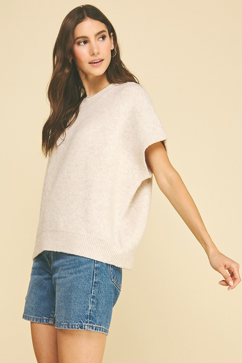 Bailey solid cap sleeve knit sweater in a neutral tone with a relaxed silhouette.