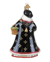 Traditional Slovak Father Christmas ornament with red suit, white beard, black hat, gold trim, and green background.
