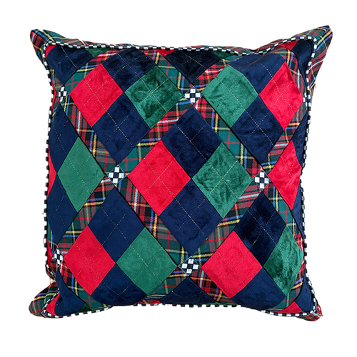 Square throw pillow with a patchwork diamond pattern in red, green, navy velvet, and plaid fabric.