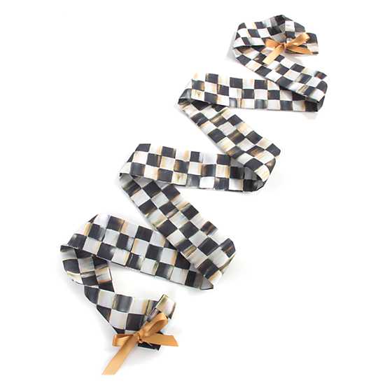 Eighty-five inch Courtly Check cord cover in poly-silk dupioni with ribbon-tie ends.