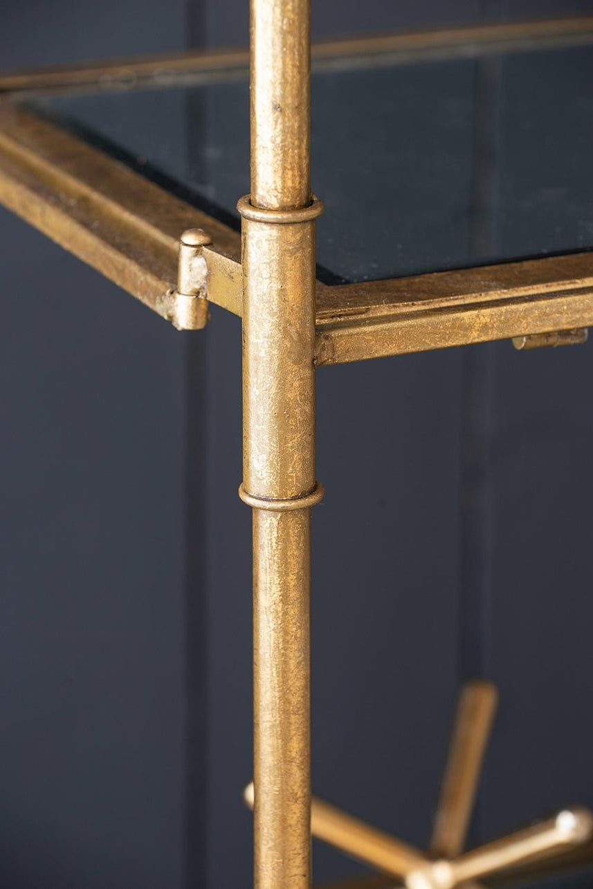 Perisa Mirror Shelf: a rectangular wall-mounted unit with a reflective mirrored front surface and open shelving below.