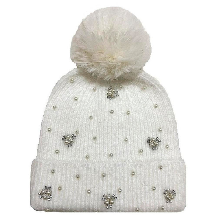 Black knit beanie with a fluffy pom pom top and pearl stud embellishments.