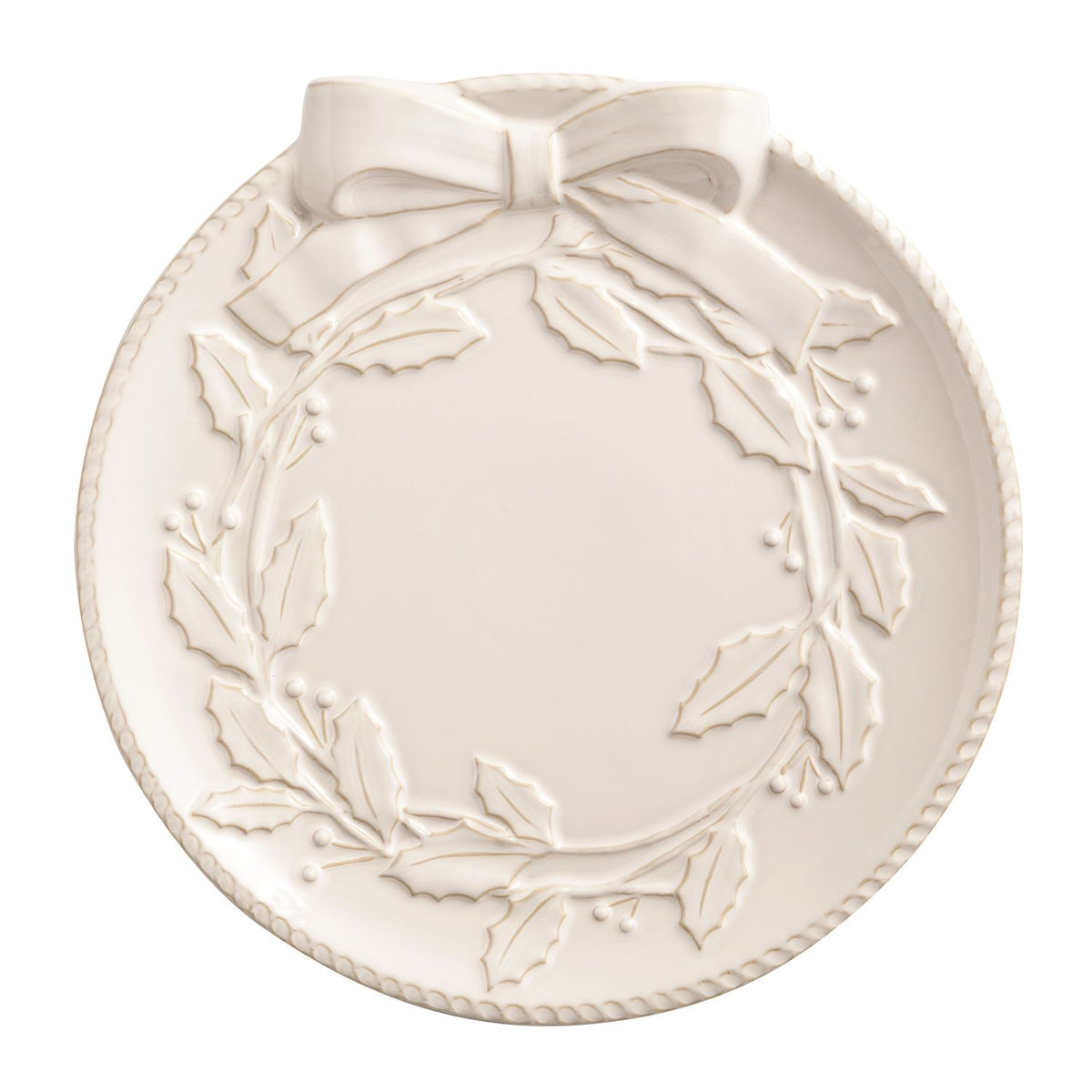 White stoneware platter featuring an embossed holly wreath design with a bow at the top.